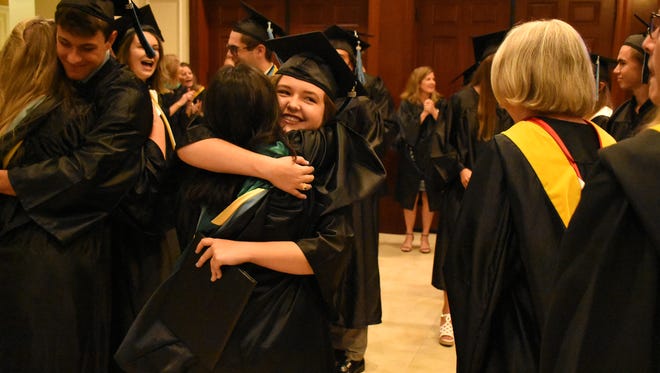 Hugs all around for new grads and their family members. Marco Island Academy graduated its 2018 senior class Friday evening in a ceremony at the Family Church.