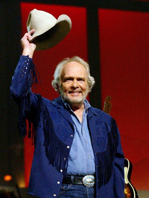 Merle Haggard says goodnight to the crowd during the "Grand Ole Opry" on Sept. 27, 2003.