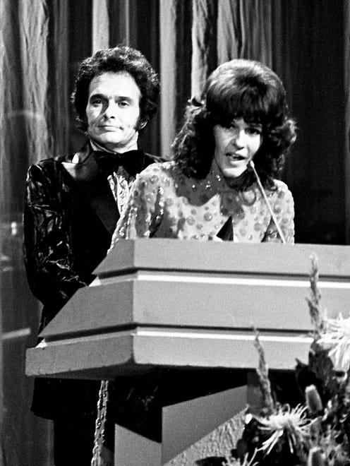 Donna Fargo, right, is thankful after winning the Single of the Year award during the CMA Awards show Oct. 16, 1972. Looking on is Merle Haggard, one of the presenters.