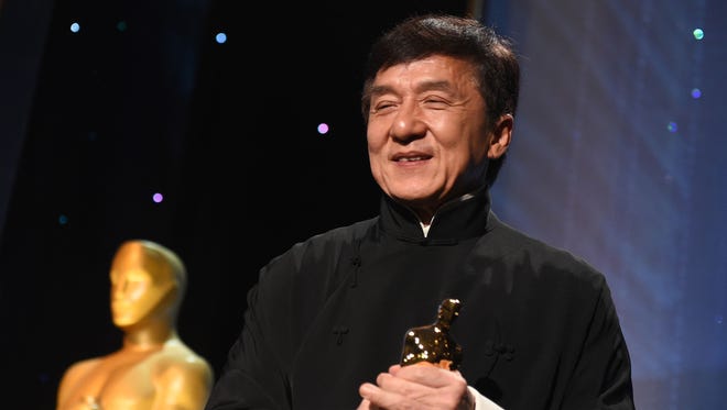 Jackie Chan poses with his honorary Oscar during the eighth annual Governors Awards.