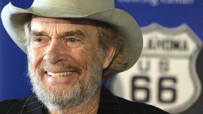Country music legend Merle Haggard smiles during a news conference at the Smithsonian's National Museum of American History in Washington on May 28, 2003. Haggard  and his sister Lillian Haggard Hoge donated belongings taken on their family's Dust Bowl-era move from Oklahoma to California on Route 66.