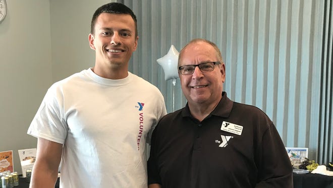 The Y’s Sports & Wellness Director Lee Pinkham, left, is seen with volunteer Anthony DeLucia (also known on the island as Steve Reynolds).