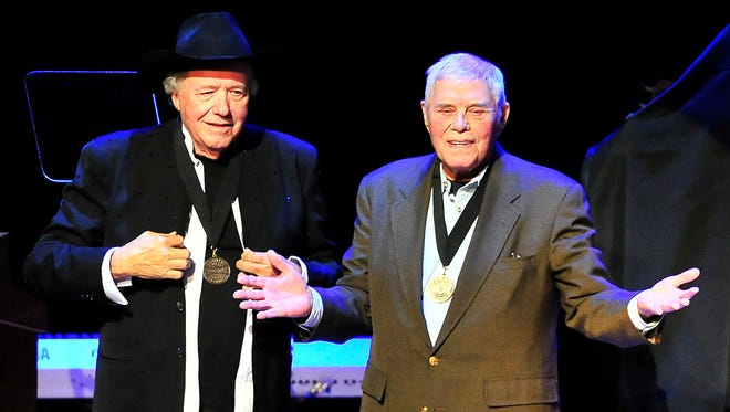 Bobby Bare, left, receives a medal from Tom T. Hall during the Medallion Ceremony at Country Music Hall of Fame in Nashville on Oct. 27.