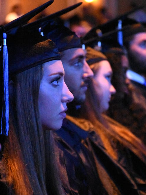 Graduating seniors listen to the speakers. Marco Island Academy graduated its 2018 senior class Friday evening in a ceremony at the Family Church.