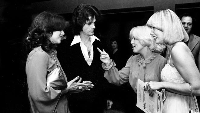 Among the winners of the Gospel Music Association's Dove Awards ceremony at the Hyatt Regency on Nov. 29, 1977, are singers B.J. Thomas, second from left, and Evie Tornquist, second from right. Thomas won a Dove for Best Album by a Non-Gospel Artist, while Tornquist won Best Female Gospel Vocalist. Looking on are Mrs. Thomas, left, and singer Sharalee Lucas.