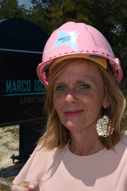 Principal Melissa Scott sports a sequined pink hardhat. Marco Island Academy, the island's charter high school, broke ground for phase one of their permanent campus Monday morning, and announced progress in their overall fundraising campaign.