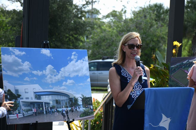 MIA founder Jane Watt speaks next to a rendering of the new facilities. Marco Island Academy, the island's charter high school, broke ground for phase one of their permanent campus Monday morning, and announced progress in their overall fundraising campaign.