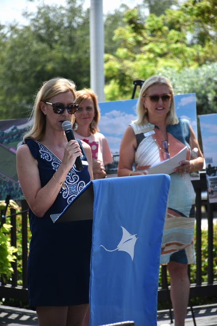 Founder Jane Watt speaks, with Marianne Iordanou, co-chair of the school's capital campaign, right, and principal Melissa Scott. Marco Island Academy, the island's charter high school, broke ground for phase one of their permanent campus Monday morning, and announced progress in their overall fundraising campaign.