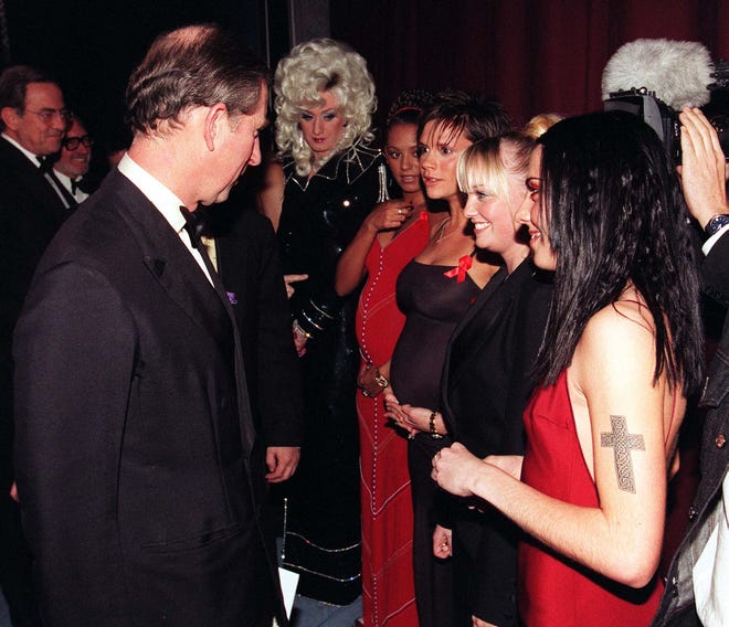 Prince Charles speaks to the Spice Girls (from left to right) Mel B, Victoria, Emma and Mel C after the 77th Royal Variety Performance at London's Lyceum Theatre on Dec. 7, 1998.