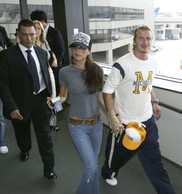 Here they are again walking through the airport on June 22, 2003, in Narita, Japan.