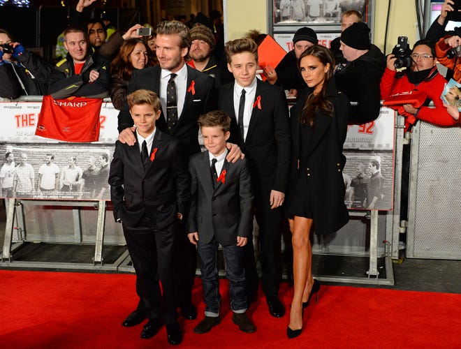 David and Victoria Beckham wrangled sons Brooklyn, Romeo and Cruz together at the premiere of the documentary "The Class of 92" in London's on Dec. 1, 2013.