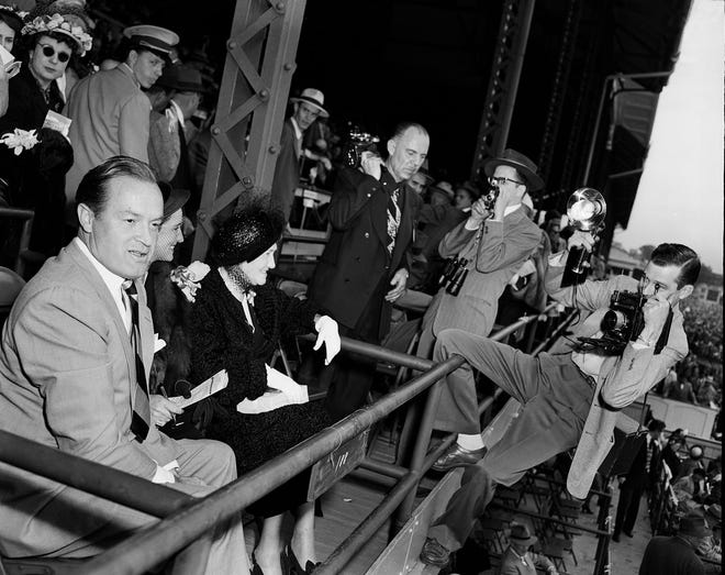 Actor, comedian Bob Hope is surrounded by photographers while attending the Kentucky Derby on May 6, 1950.