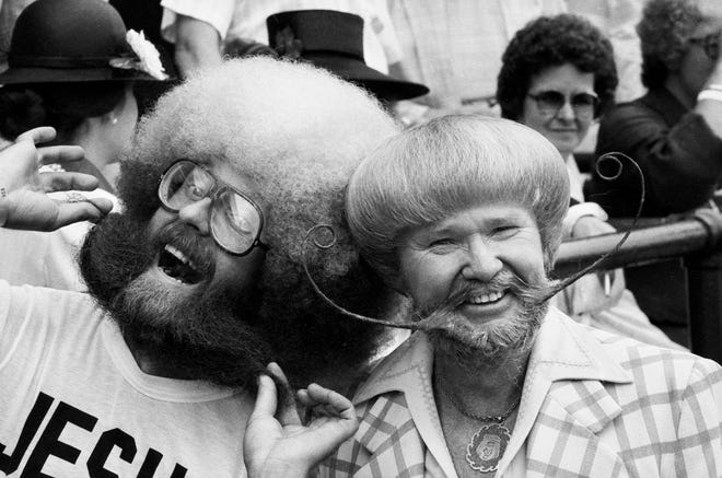 Two men show off their unusual facial and hairstyles at the Kentucky Derby on May 1, 1982.
