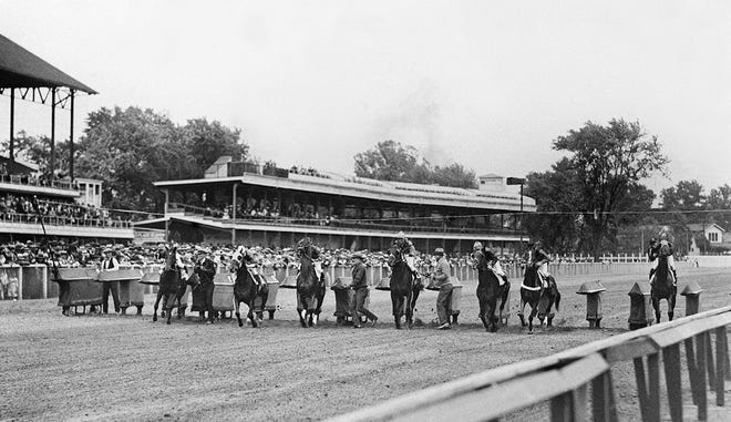 The start of a race on Derby day at Churchill Downs using a starting gate, May 5, 1936.
