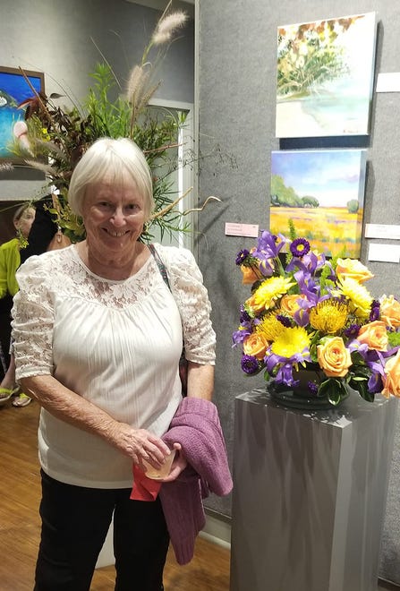 Exhibit attendees voted for their favorite designs, with Bonnie Colman winning first place in The People’s Choice awards for her floral design interpreting a landscape of yellows and purples.