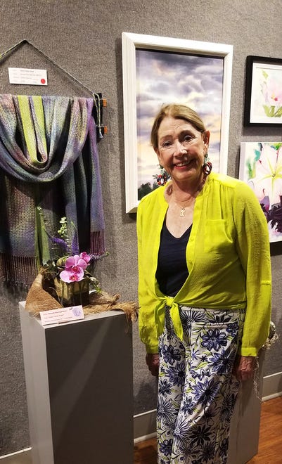 Linda Spell won second place in The People’s Choice awards for her miniature design of lavender and purple reflecting the colors of Nanette Baumgardner’s woven shawl.