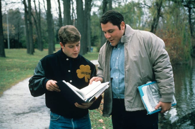 Rudy (Astin) and his tutor D-Bob (Jon Favreau) go over school work in " Rudy. " Favreau ' s " Swingers " co-star Vince Vaughn also appeared in the film.