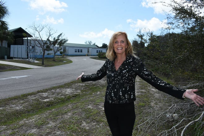 Principal Melissa Scott shows where the school's new buildings will rise. Marco Island Academy is embarking on a capital campaign to raise millions of dollars and give the school a permanent home, after years of operating in prefab modules.
