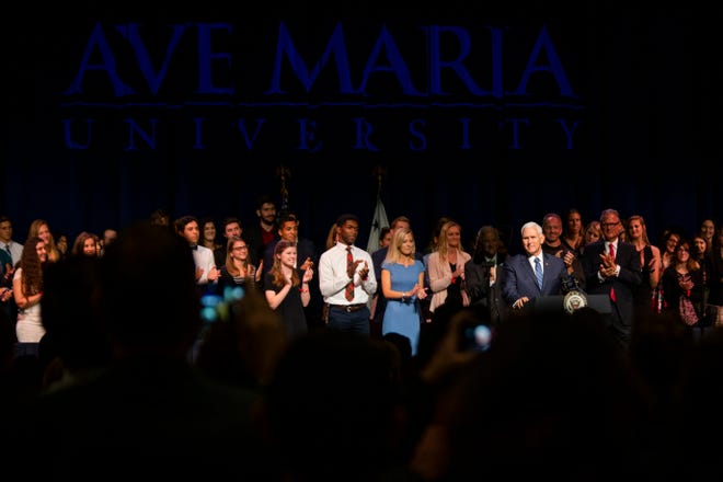 Vice President Mike Pence is greeted by a crowd as he takes the stage at the O'Bryan Performance Hall in the Thomas and Selby Prince Building at Ave Maria University on Thursday, March 28, 2019.