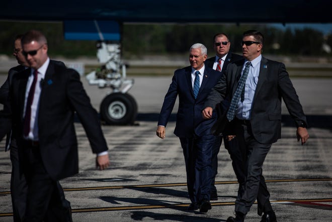 Vice President Mike Pence walks toward the crowd that awaited his arrival at the Naples Airport on Thursday, March 28, 2019.