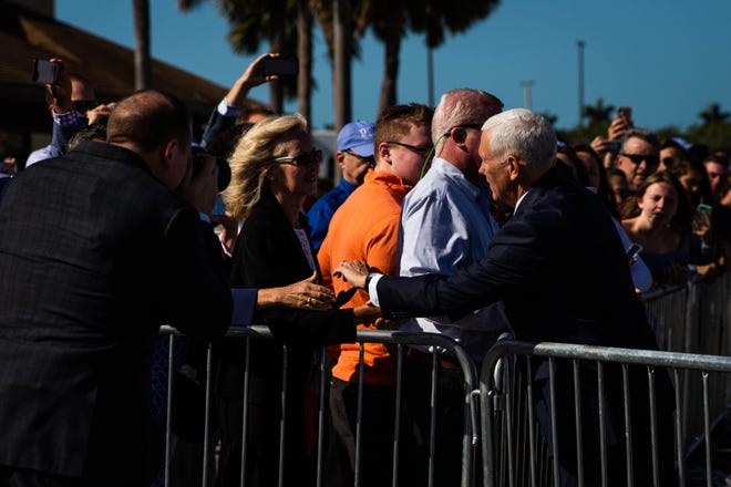 Vice President Mike Pence greets friends and family awaiting his arrival at the Naples Airport via Air Force Two on Thursday, March 28, 2019.