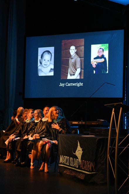 Dignitaries on stage watch then and now photos of the graduates. Marco Island Academy held its 2019 commencement ceremony Friday evening at the Family Church.