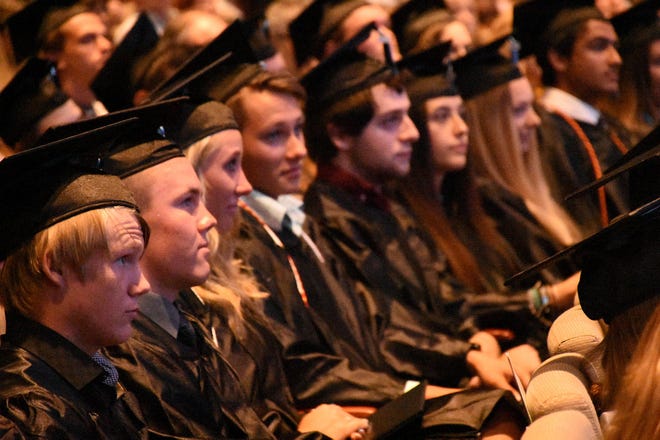 Graduates listen to the speeches and well-wishes. Marco Island Academy held its 2019 commencement ceremony Friday evening at the Family Church.