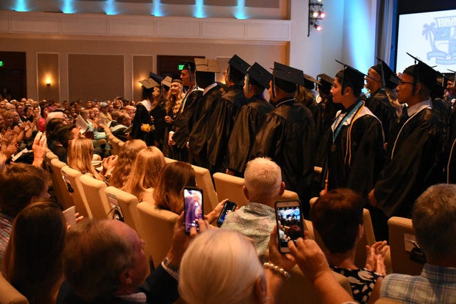 The graduating class stands to be recognized by the assembled supporters. Marco Island Academy held its 2019 commencement ceremony Friday evening at the Family Church.