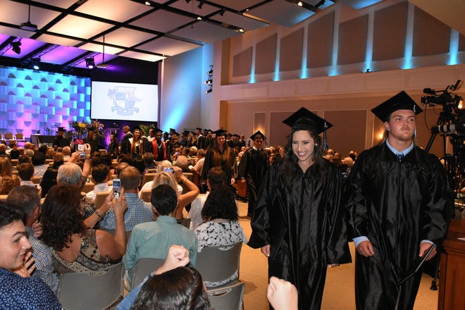 In the Recessional, graduates stream out of the sanctuary. Marco Island Academy held its 2019 commencement ceremony Friday evening at the Family Church.