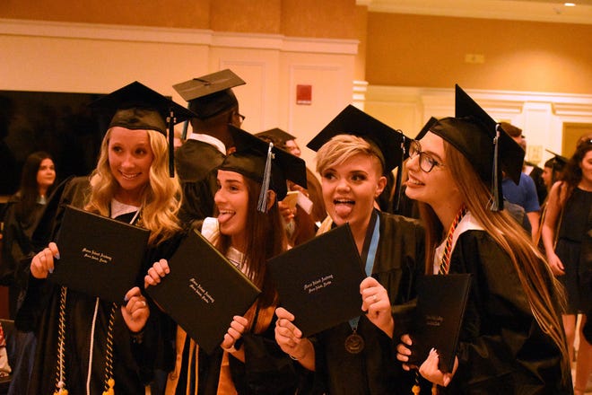 Grads ham it up for a photo. Marco Island Academy held its 2019 commencement ceremony Friday evening at the Family Church.