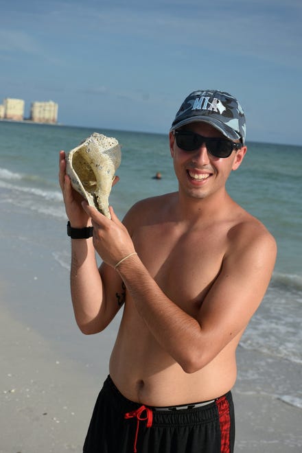 Camp counselor Carson Bruner with a shell he found on Tigertail Beach. Marco Island Academy's Ambassadors of the Environment summer camp took middle and high school students around the area to explore our natural surroundings last week.