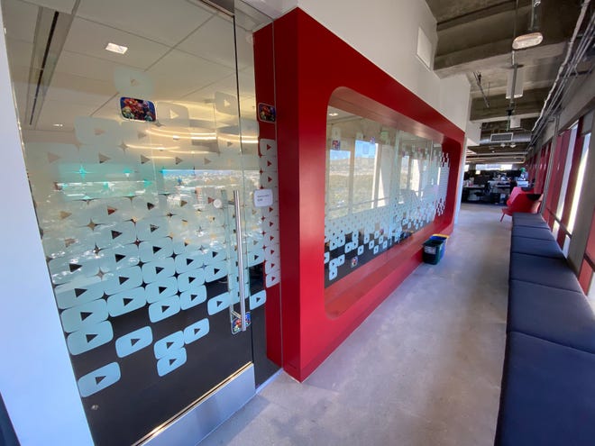 A YouTube "play" button themed conference room at YouTube HQ