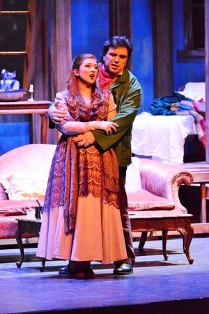 Mimi (Sarah Tucker) and Rodolfo (Peter Lake) as the young lovers in the Gulfshore Opera production of  "La Boheme" in its Barbara B. Mann Performing Arts Hall debut. This season it sings there and at Artis--Naples.
