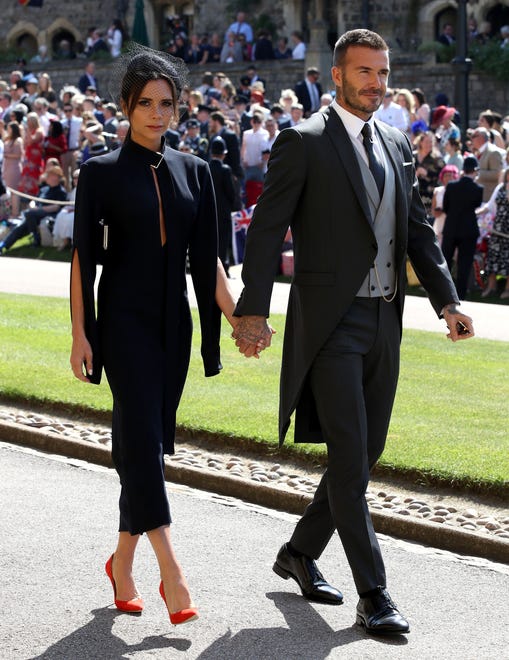 The couple, naturally, made an appearance at the royal wedding for Prince Harry and Duchess Meghan on May 19, 2018, in Windsor, England. Beckham sported a split sleeve dress from her collection.