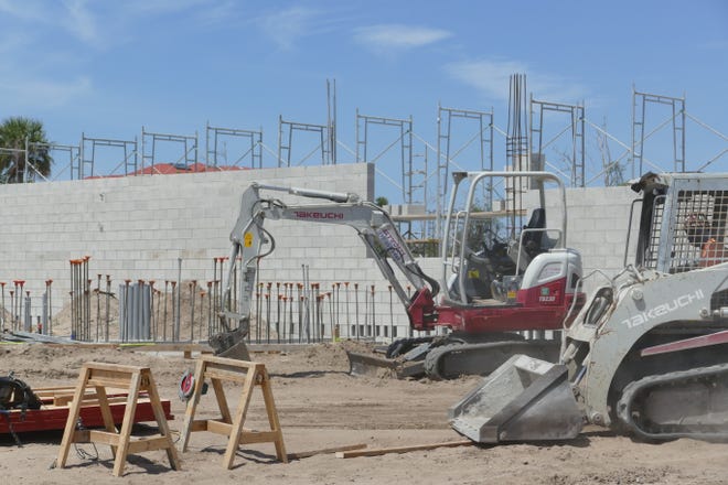 Construction workers build Marco Island Academy's new facilities May 7, 2020.
