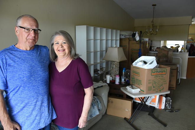 Anthony DeLucia, aka Steve Reynolds, and his wife June DeLucia amid packing boxes. After 18 years of active civic life on Marco Islnd, Reynolds is returning to his original home in Ohio.
