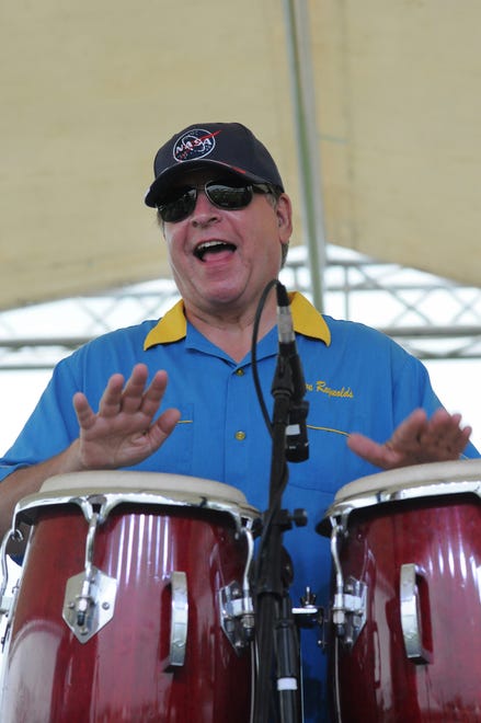 In this file photo, Steve Reynolds plays congas during the Marco Island Seafood and Music Festival, where he assembled the musical acts and emceed.
