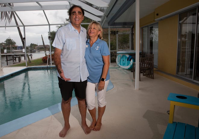 George and Cindy Abounader pose for a portrait, Friday, July 17, 2020, at their home in Marco Island.