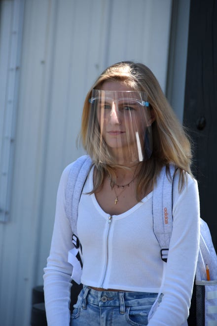 Freshman Piper Noyes in her face shield Tuesday. Marco Island Academy, the island's charter high school, opened its doors to students on Wednesday, August 12.