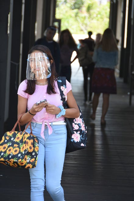 Students exit the school after classes on Tuesday. Marco Island Academy, the island's charter high school, opened its doors to students on Wednesday, August 12.