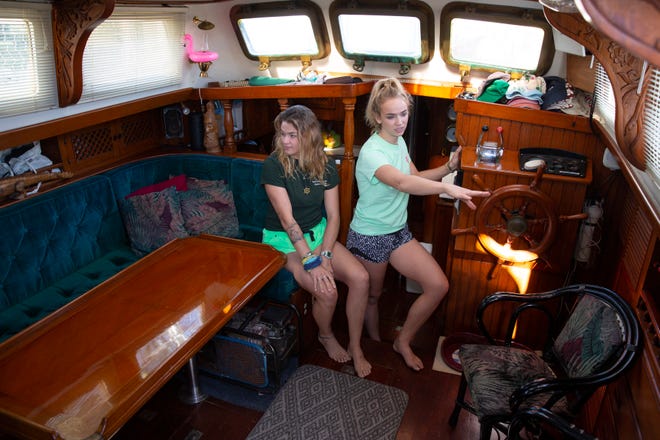 Nathalie Meyers and her sister Sascha Meyers provide a tour of the cabin of The Far Side, Thursday, Dec. 24, 2020, at their home in Marco Island. .