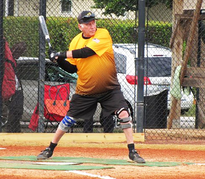 Jerry Engel strides into a pitched ball against Joey’s Pizza