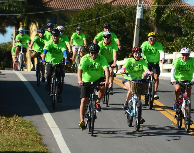 A pack of riders by Tigertail Beach. The 11th Tour de Marco saw hundreds of cyclists riding 15 or 30 miles around the island on Sunday morning to benefit the YMCA.