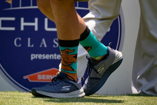 Keith Nolan, caddie for golfer Scott Parel, wears Scooby-doo socks during the first day of the Chubb Classic, Friday, April 16, 2021, at the Tiburon Golf Club in North Naples. Nolan and Parel wore the special socks in memory of Chubb Classic volunteer  Brendan Cunningham, for who was known for wearing eccentric socks.