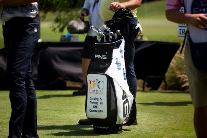 Kirk Triplett's golf bag displays the logo for Dedication to Community, an organization started by former NFL player and FBI agent Quentin Williams, during day two of the Chubb Classic at Tiburón Golf Club in North Naples on Saturday, April 17, 2021.