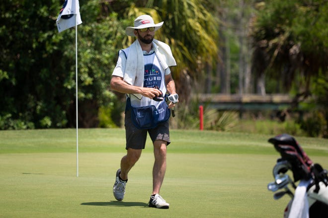 Actor Lucas Black caddies for Craig Bowden during day two of the Chubb Classic at Tiburón Golf Club in North Naples on Saturday, April 17, 2021.