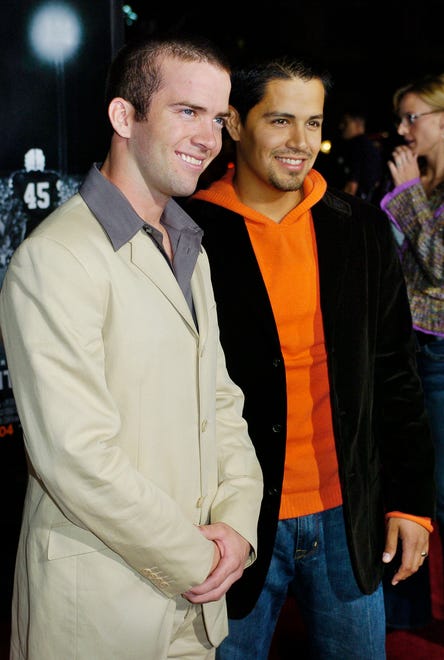"Friday Night Lights" cast members Lucas Black, left, and Jay Hernandez pose together at the premiere of the film at Grauman's Chinese Theater in Los Angeles, Wednesday, Oct. 6, 2004. The film is based on H.G. Bissinger's prize-winning book chronicling the 1988 season of the Permian High Panthers football team of Odessa, Texas. (AP Photo/Chris Pizzello)