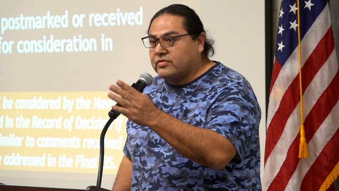 In this April 26, 2020 photo Myron Dewey, a filmmaker and member of the Walker River Paiute Tribe, speaks out against a proposed expansion of the Fallon Naval Air Station during a public meeting in Fallon, Nev.