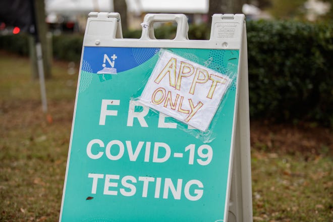 A handwritten sign that reads "APPT ONLY," is taped to an A-frame sign for free COVID tests outside the drive-up testing site in the Lake Jackson library parking lot Monday, Jan. 3, 2022.